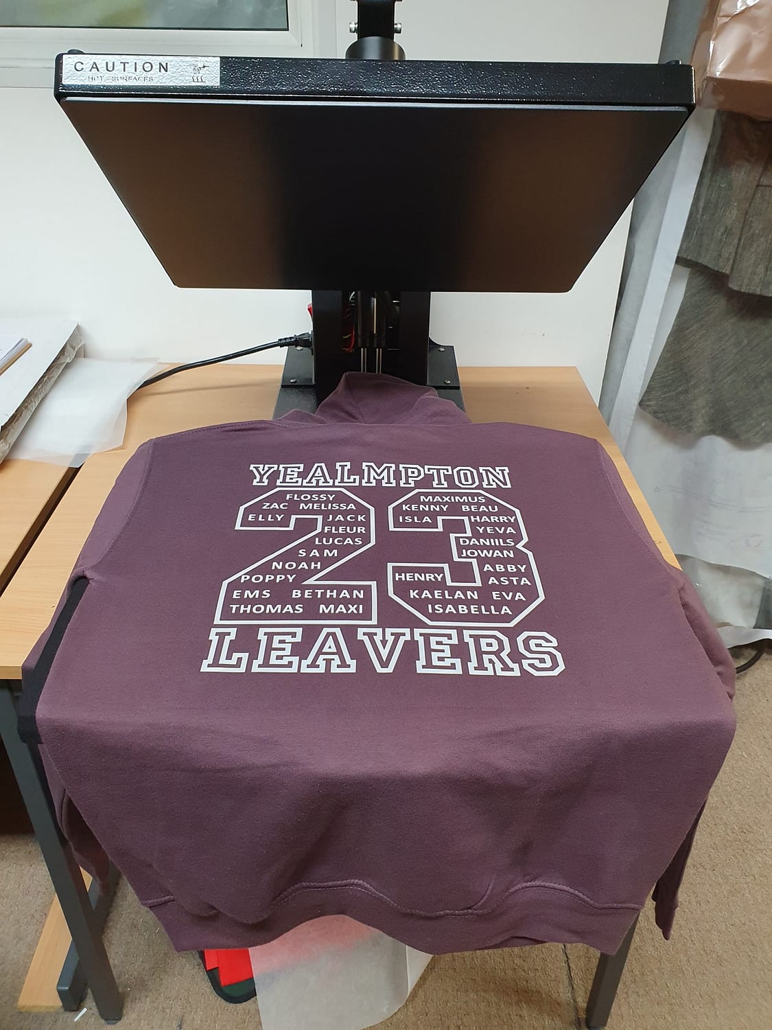 Clothing with printed design, in a printing press